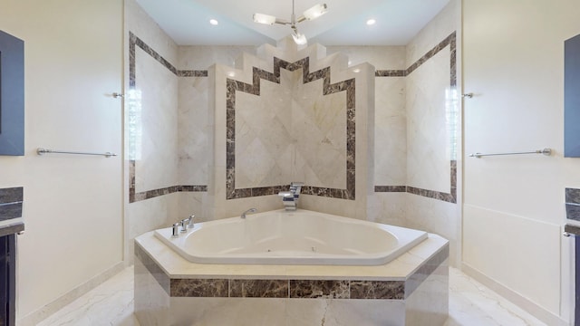 401 SE Verada Ave, Port Saint Lucie, FL 34983 - bathroom with a jetted tub, marble finish flooring, recessed lighting, and baseboards