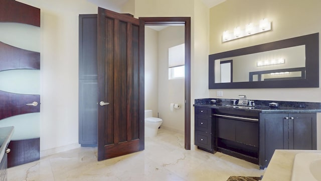 401 SE Verada Ave, Port Saint Lucie, FL 34983 - full bathroom with vanity, marble finish flooring, toilet, and baseboards