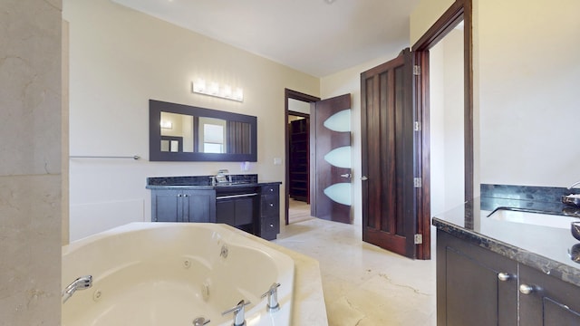 401 SE Verada Ave, Port Saint Lucie, FL 34983 - bathroom featuring vanity and a tub with jets