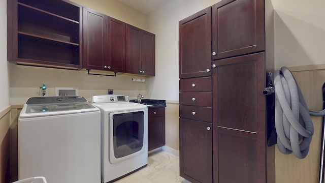 401 SE Verada Ave, Port Saint Lucie, FL 34983 - laundry room with cabinet space, washer and clothes dryer, and light marble finish floors