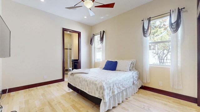 401 SE Verada Ave, Port Saint Lucie, FL 34983 - bedroom with multiple windows, light wood-style floors, baseboards, and recessed lighting