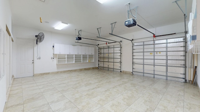 401 SE Verada Ave, Port Saint Lucie, FL 34983 - garage featuring a garage door opener and baseboards
