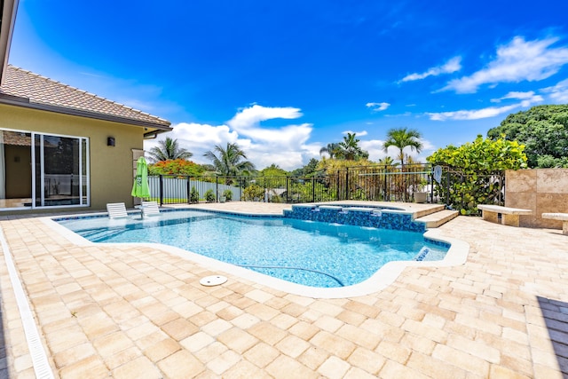 401 SE Verada Ave, Port Saint Lucie, FL 34983 - view of swimming pool with a patio area and a pool with connected hot tub