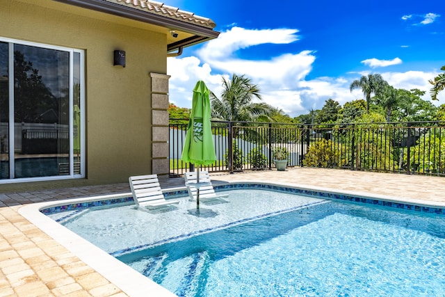 401 SE Verada Ave, Port Saint Lucie, FL 34983 - view of swimming pool featuring a patio