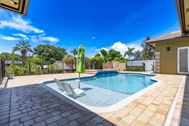 401 SE Verada Ave, Port Saint Lucie, FL 34983 - view of pool with a patio, a fenced backyard, and an in-ground hot tub