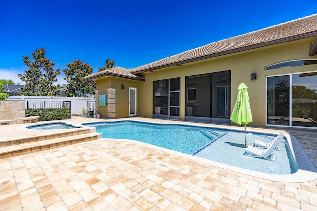 401 SE Verada Ave, Port Saint Lucie, FL 34983 - view of swimming pool with an in-ground hot tub, a patio, and a sunroom
