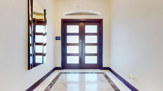 401 SE Verada Ave, Port Saint Lucie, FL 34983 - foyer with baseboards and inlaid floor details