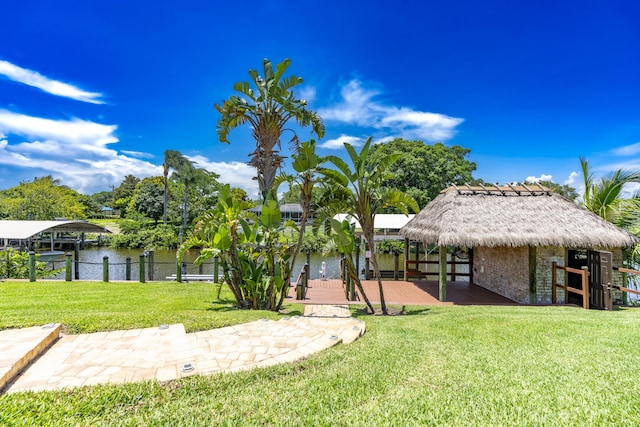 401 SE Verada Ave, Port Saint Lucie, FL 34983 - surrounding community with boat lift, a yard, a dock, a gazebo, and a water view