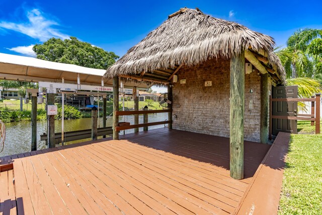 401 SE Verada Ave, Port Saint Lucie, FL 34983 - dock area featuring a water view and boat lift