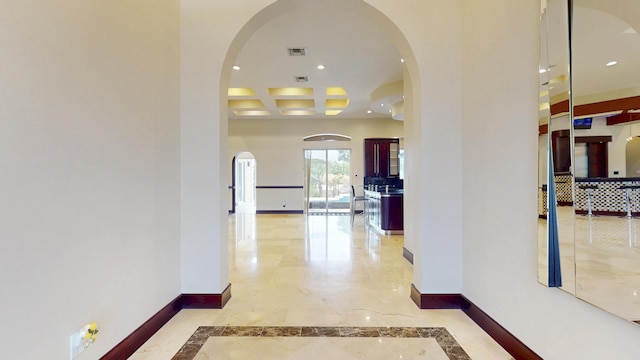401 SE Verada Ave, Port Saint Lucie, FL 34983 - hallway with baseboards, recessed lighting, coffered ceiling, inlaid floor details, and arched walkways