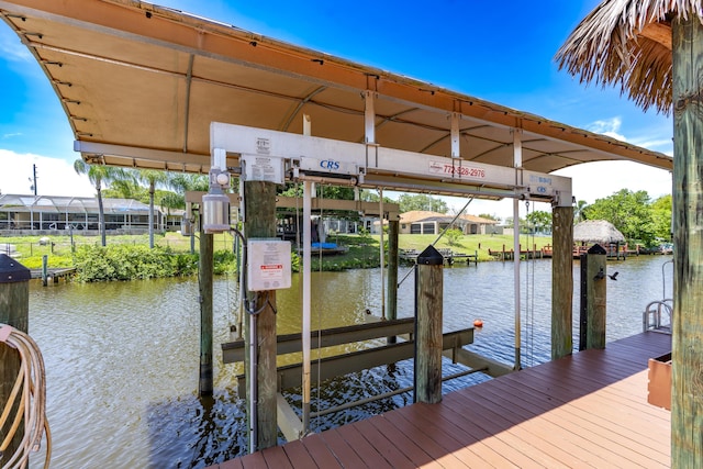 401 SE Verada Ave, Port Saint Lucie, FL 34983 - dock area featuring boat lift and a water view