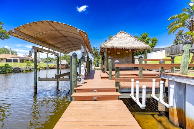 401 SE Verada Ave, Port Saint Lucie, FL 34983 - dock featuring boat lift, a water view, and a gazebo