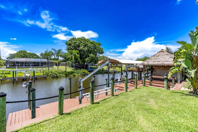 401 SE Verada Ave, Port Saint Lucie, FL 34983 - view of property's community with a yard, a dock, and boat lift
