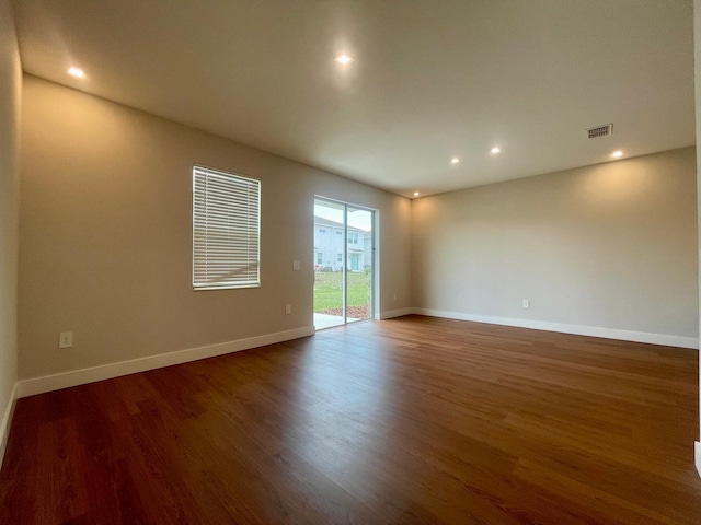 6159 Peaceful Park Way, Clermont, FL 34714 - empty room with wood finished floors, recessed lighting, and baseboards