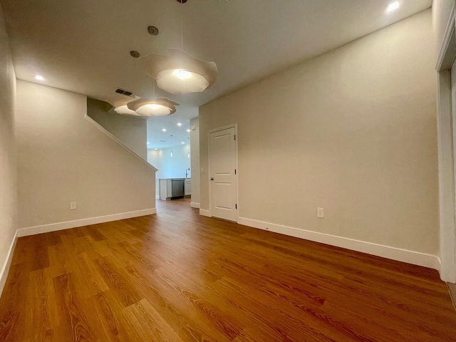 6159 Peaceful Park Way, Clermont, FL 34714 - unfurnished room featuring wood finished floors, baseboards, and stairway