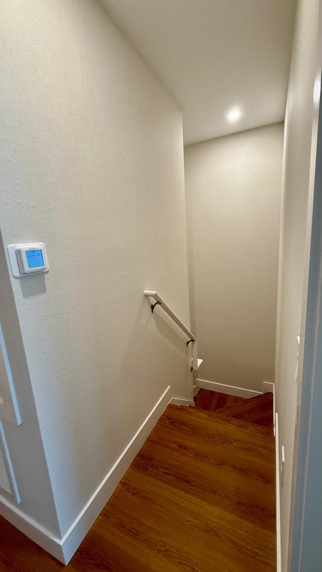 6159 Peaceful Park Way, Clermont, FL 34714 - stairway with baseboards and wood finished floors
