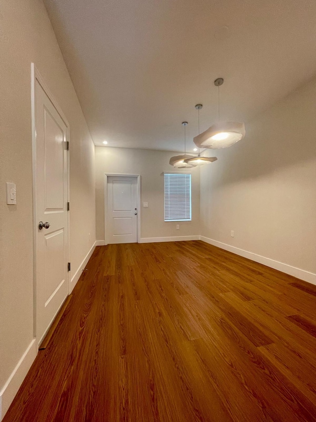 6159 Peaceful Park Way, Clermont, FL 34714 - empty room featuring wood finished floors, baseboards, and recessed lighting