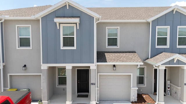 6159 Peaceful Park Way, Clermont, FL 34714 - townhome / multi-family property featuring roof with shingles and board and batten siding