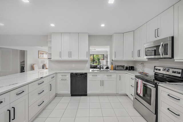 6170 Brandon St, Palm Beach Gardens, FL 33418 - kitchen with stainless steel appliances, white cabinets, a sink, open shelves, and light tile patterned floors