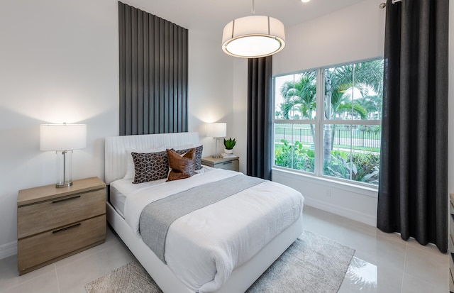 10710 Stellar Cir Unit 03, Palm Beach Gardens, FL 33412 - bedroom with light tile patterned floors and baseboards