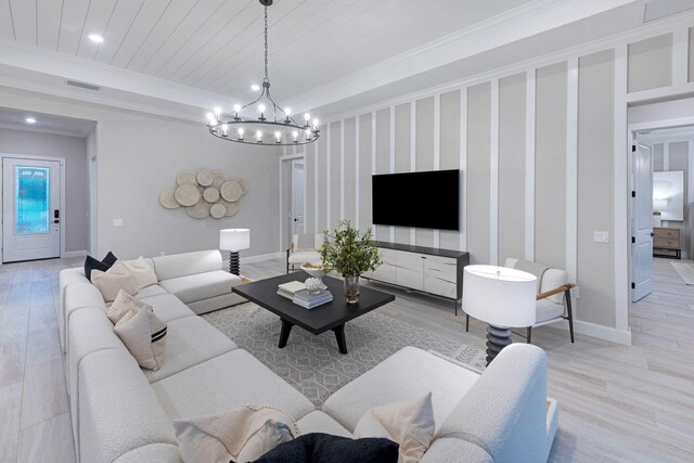 10710 Stellar Cir Unit 03, Palm Beach Gardens, FL 33412 - living area with light wood-type flooring, a chandelier, crown molding, baseboards, and recessed lighting