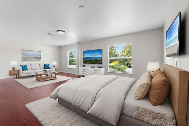 6057 Ridgelake Cir, Vero Beach, FL 32967 - bedroom featuring wood finished floors and baseboards