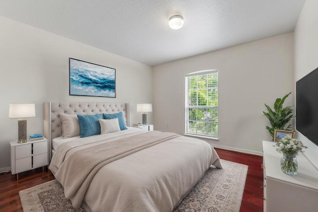 6057 Ridgelake Cir, Vero Beach, FL 32967 - bedroom with dark wood finished floors and baseboards
