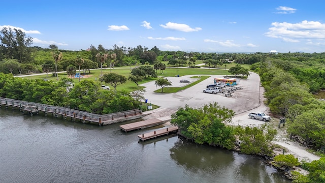 6057 Ridgelake Cir, Vero Beach, FL 32967 - drone / aerial view of a tree filled landscape and a large body of water