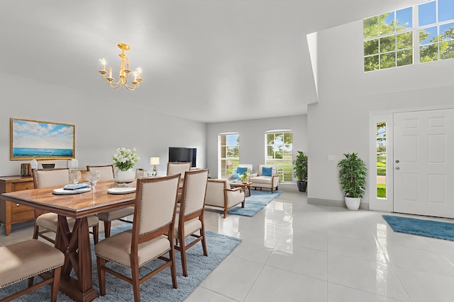 6057 Ridgelake Cir, Vero Beach, FL 32967 - dining space featuring a chandelier, light tile patterned floors, and baseboards