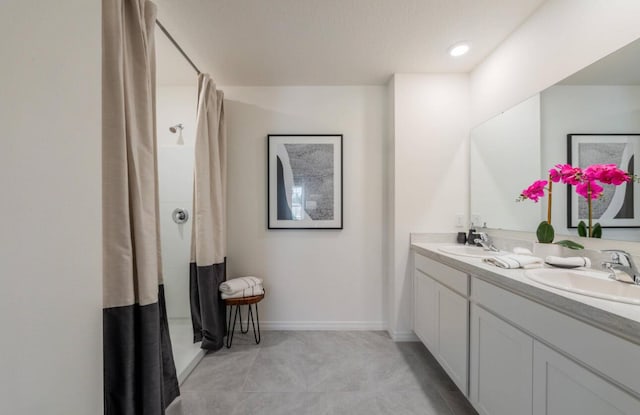 12276 Nettuno Way, Port Saint Lucie, FL 34987 - full bath featuring double vanity, curtained shower, baseboards, and tile patterned flooring