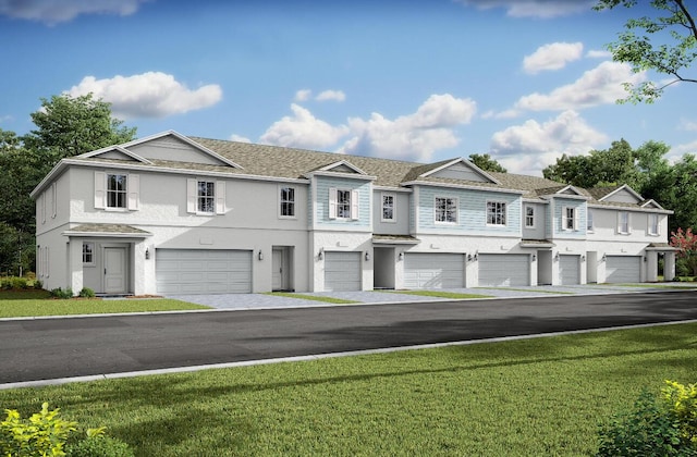 608 Waters Edge Ln Unit 2202, Port Saint Lucie, FL 34983 - multi unit property with stucco siding, a garage, and a front lawn
