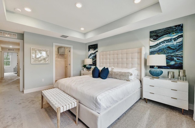 608 Waters Edge Ln Unit 2202, Port Saint Lucie, FL 34983 - carpeted bedroom featuring a raised ceiling, baseboards, recessed lighting, and a spacious closet