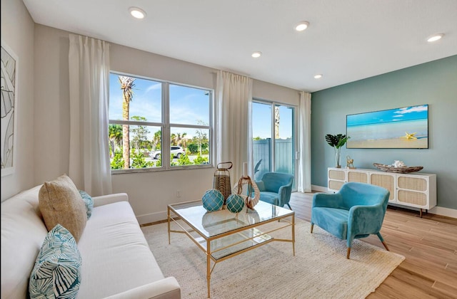 608 Waters Edge Ln Unit 2202, Port Saint Lucie, FL 34983 - living area with baseboards, recessed lighting, and light wood-style flooring
