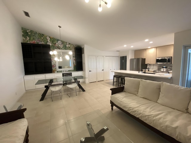 9124 Sun Terrace Cir Unit D, West Palm Beach, FL 33403 - living area with lofted ceiling, recessed lighting, and a chandelier