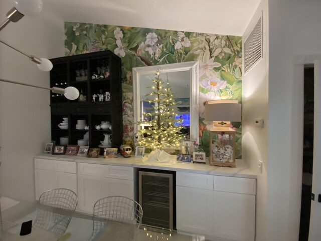 9124 Sun Terrace Cir Unit D, West Palm Beach, FL 33403 - indoor dry bar with wine cooler and wallpapered walls