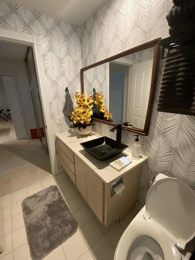 9124 Sun Terrace Cir Unit D, West Palm Beach, FL 33403 - bathroom featuring wallpapered walls, tile patterned flooring, and vanity