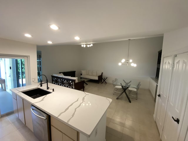 9124 Sun Terrace Cir Unit D, West Palm Beach, FL 33403 - kitchen featuring a sink, dishwasher, recessed lighting, a center island with sink, and light stone countertops