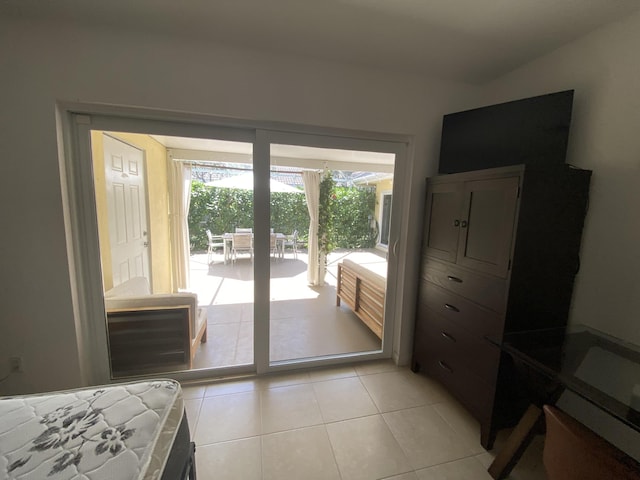 9124 Sun Terrace Cir Unit D, West Palm Beach, FL 33403 - bedroom with access to outside and light tile patterned floors