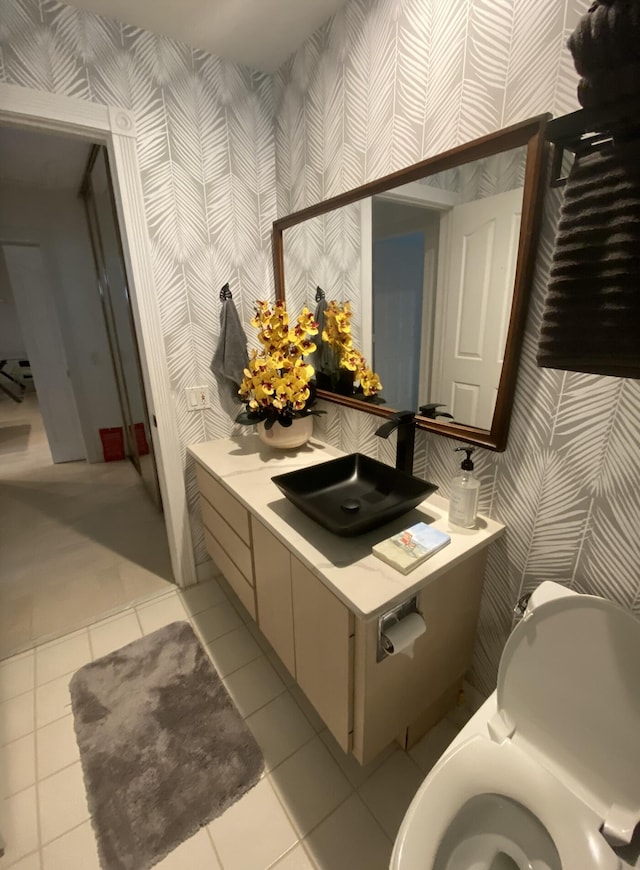 9124 Sun Terrace Cir Unit D, West Palm Beach, FL 33403 - bathroom featuring wallpapered walls, tile patterned floors, and vanity