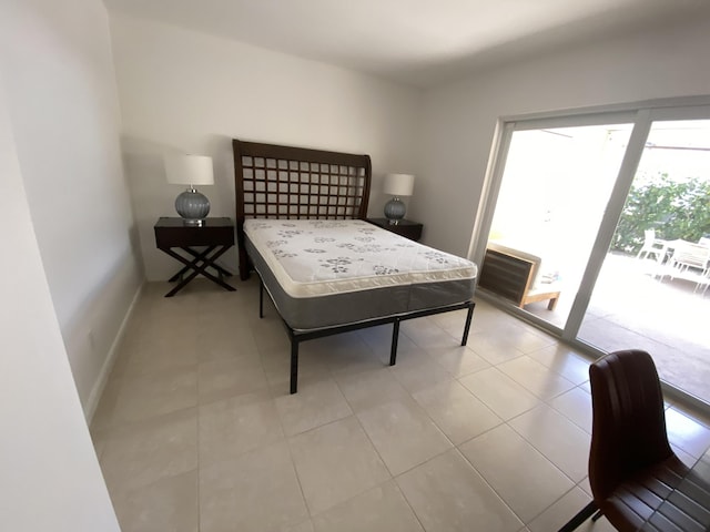 9124 Sun Terrace Cir Unit D, West Palm Beach, FL 33403 - bedroom featuring access to outside, baseboards, and light tile patterned floors