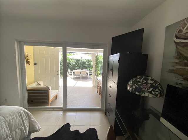 9124 Sun Terrace Cir Unit D, West Palm Beach, FL 33403 - bedroom featuring access to outside and light tile patterned flooring