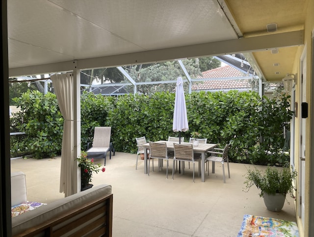 9124 Sun Terrace Cir Unit D, West Palm Beach, FL 33403 - view of patio with outdoor dining area and a lanai