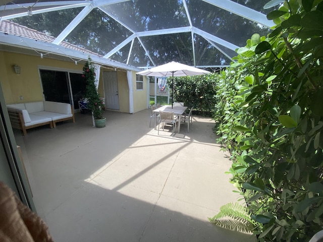 9124 Sun Terrace Cir Unit D, West Palm Beach, FL 33403 - view of patio with outdoor dining space and glass enclosure
