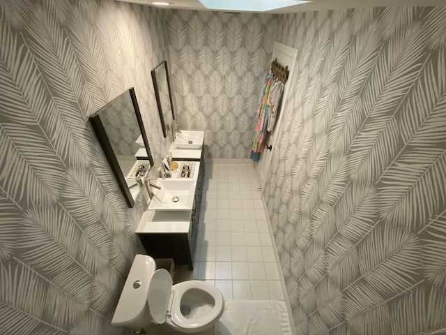 9124 Sun Terrace Cir Unit D, West Palm Beach, FL 33403 - bathroom featuring wallpapered walls and toilet