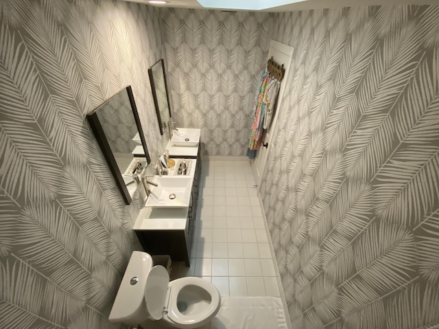 9124 Sun Terrace Cir Unit D, West Palm Beach, FL 33403 - bathroom with wallpapered walls, toilet, and double vanity
