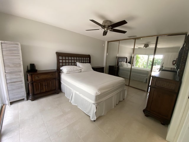 9124 Sun Terrace Cir Unit D, West Palm Beach, FL 33403 - bedroom featuring light tile patterned floors, a ceiling fan, and a closet