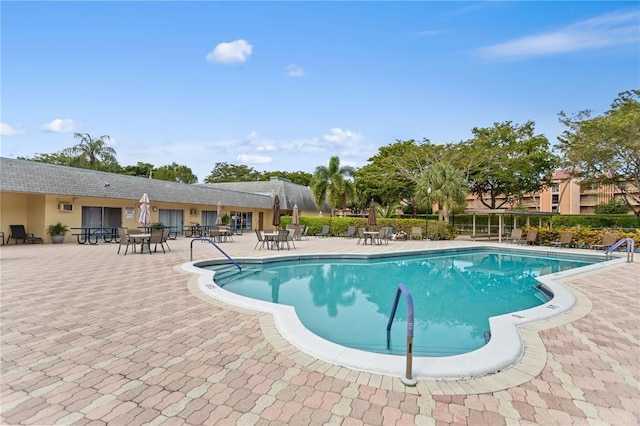 251 NW 76th Ave Unit 105, Margate, FL 33063 - community pool featuring a patio area