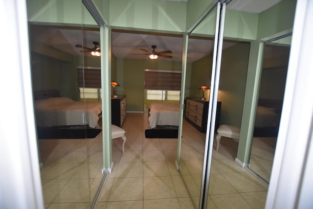 251 NW 76th Ave Unit 105, Margate, FL 33063 - ensuite bathroom with ceiling fan, tile patterned flooring, and baseboards