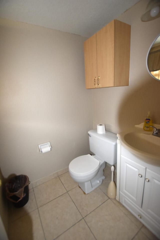 251 NW 76th Ave Unit 105, Margate, FL 33063 - half bathroom with toilet, vanity, and tile patterned floors