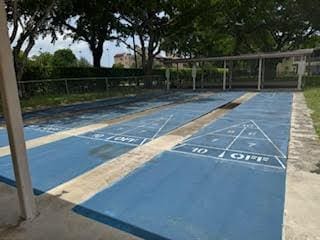 251 NW 76th Ave Unit 105, Margate, FL 33063 - view of home's community featuring uncovered parking and shuffleboard